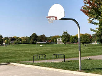 Photo of a basketball net in a park